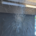 L’un des impacts de balle sur les vitres du hall du bâtiment Schuman, à La Rochelle | DR